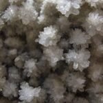 Detailed close-up capturing the complex structure of white crystal formations.